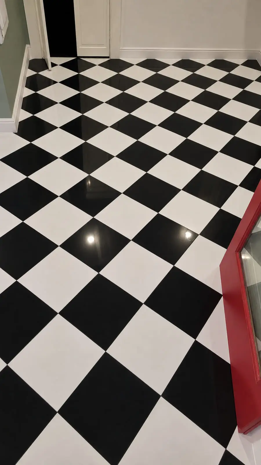 Black and white marble checkerboard floor set on the diagonal